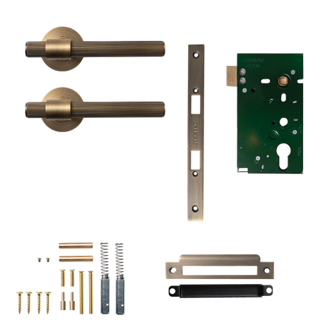Set of brass door handles and lock components on a white background. BelgraviaSolidBrassLinedMorticeLockPassageLeverSetInDarkBrushedBrass