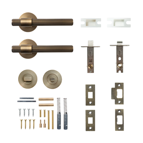 Collection of door hardware components including handles and locks on a white background. BelgraviaSolidBrassLinedTubularLatchPrivacyLeverSetInDarkBrushedBrass