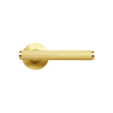 Gold door handle on a white background. BellevueKnurledLeverHandleSetBrushedSatinBrass