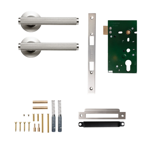 Door handle assembly with components on a white background. BellevueSolidBrassKnurledMorticeLockPassageLeverSetInDullBrushedNickel