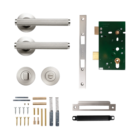 Door handle assembly with components on a white background. BellevueSolidBrassKnurledMorticeLockPrivacyLeverSetInDullBrushedNickel
