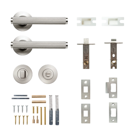 Door handle assembly with screws and hardware components on a white background. BellevueSolidBrassKnurledTubularLatchPrivacyLeverSetInDullBrushedNickel
