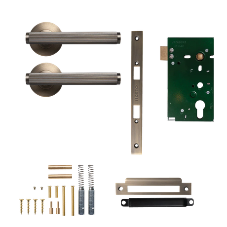 Door handle assembly with components on a white background. BellevueSolidBrassLinedMorticeLockPassageLeverSetInDarkBrushedBrass