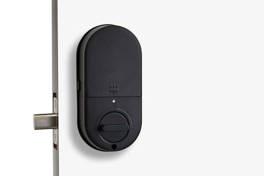 Black electronic door lock mounted on a white door. SmartDeadboltT13-back