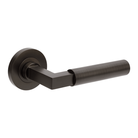 Black door handle on a white background. ZurichFlutedGN