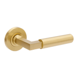 Gold door handle on a white background. ZurichFlutedSB