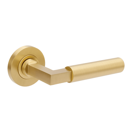 Gold door handle on a white background. ZurichFlutedSB