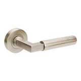 Metal door handle on a white background. ZurichHammeredBN