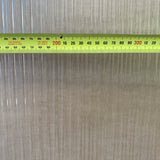 Narrowline glass close-up with a tape measure across it, showing the 10mm flutes